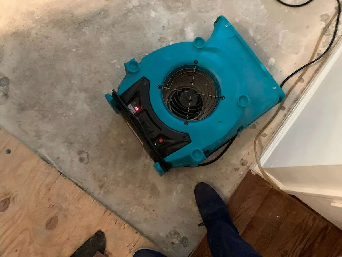 Air mover drying subfloor during Leak Detection & Repair in Belle Glade