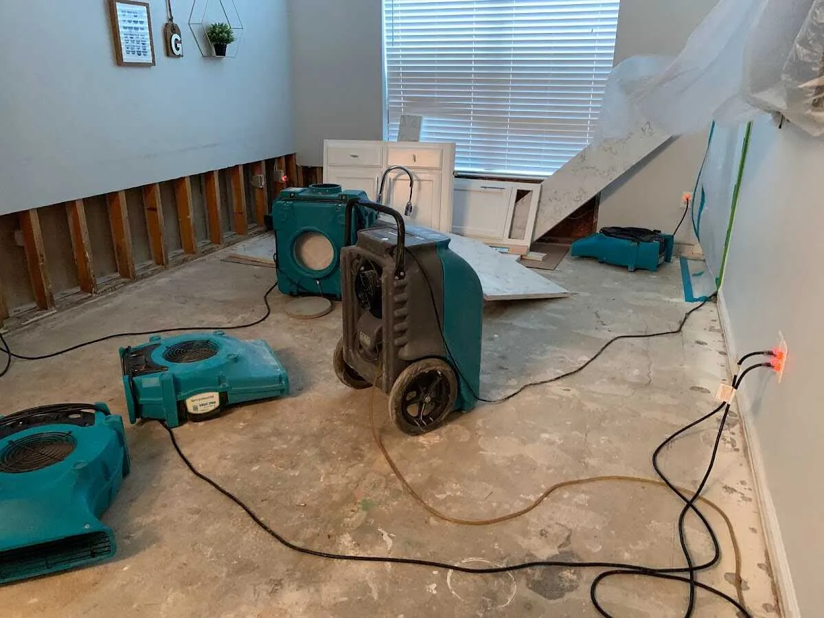 Dehumidifier in flood-cut room for Water Damage Restoration in Belle Glade